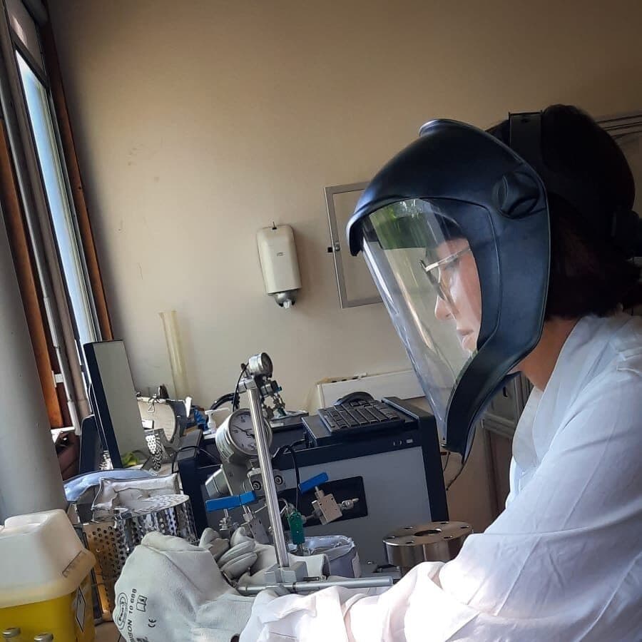 Emma working under a face shield