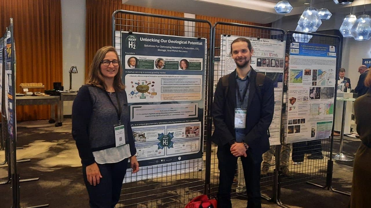 Muriel Andreani and Samuel Barbier in front of the RockyH₂ poster at H-Nat Summit 2025